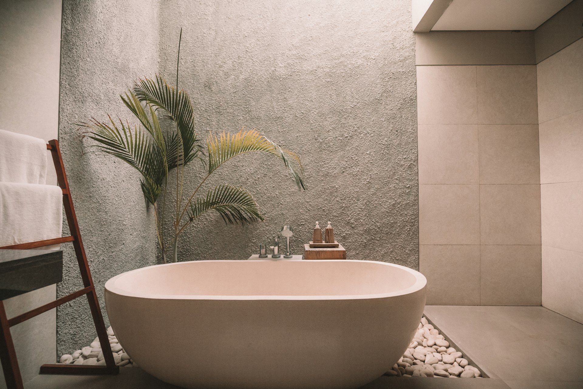 Stone-clad bathroom vanity with carved jaali panel