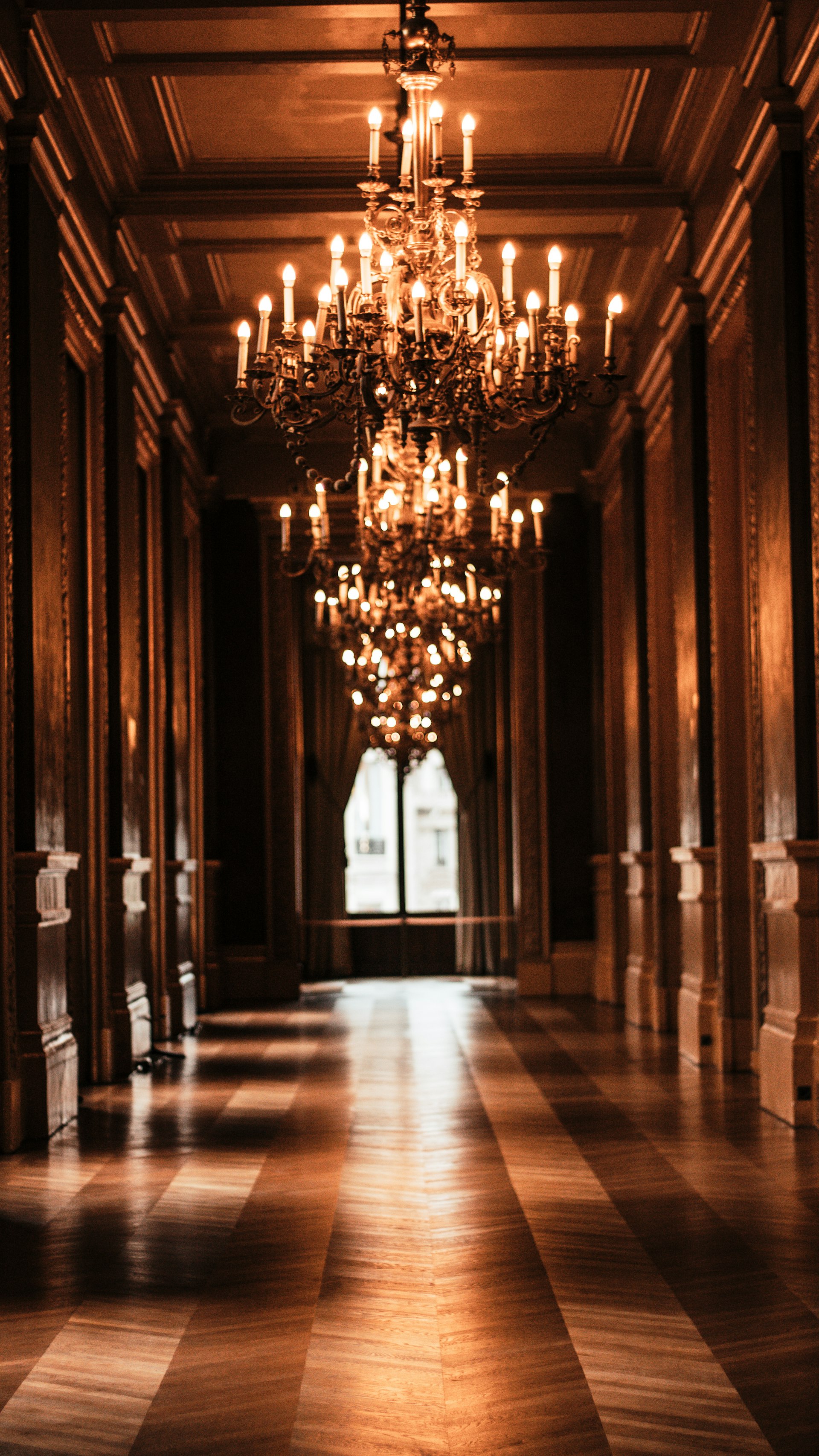 Carved marble hallway with chandelier, Stonosphere craftsmanship