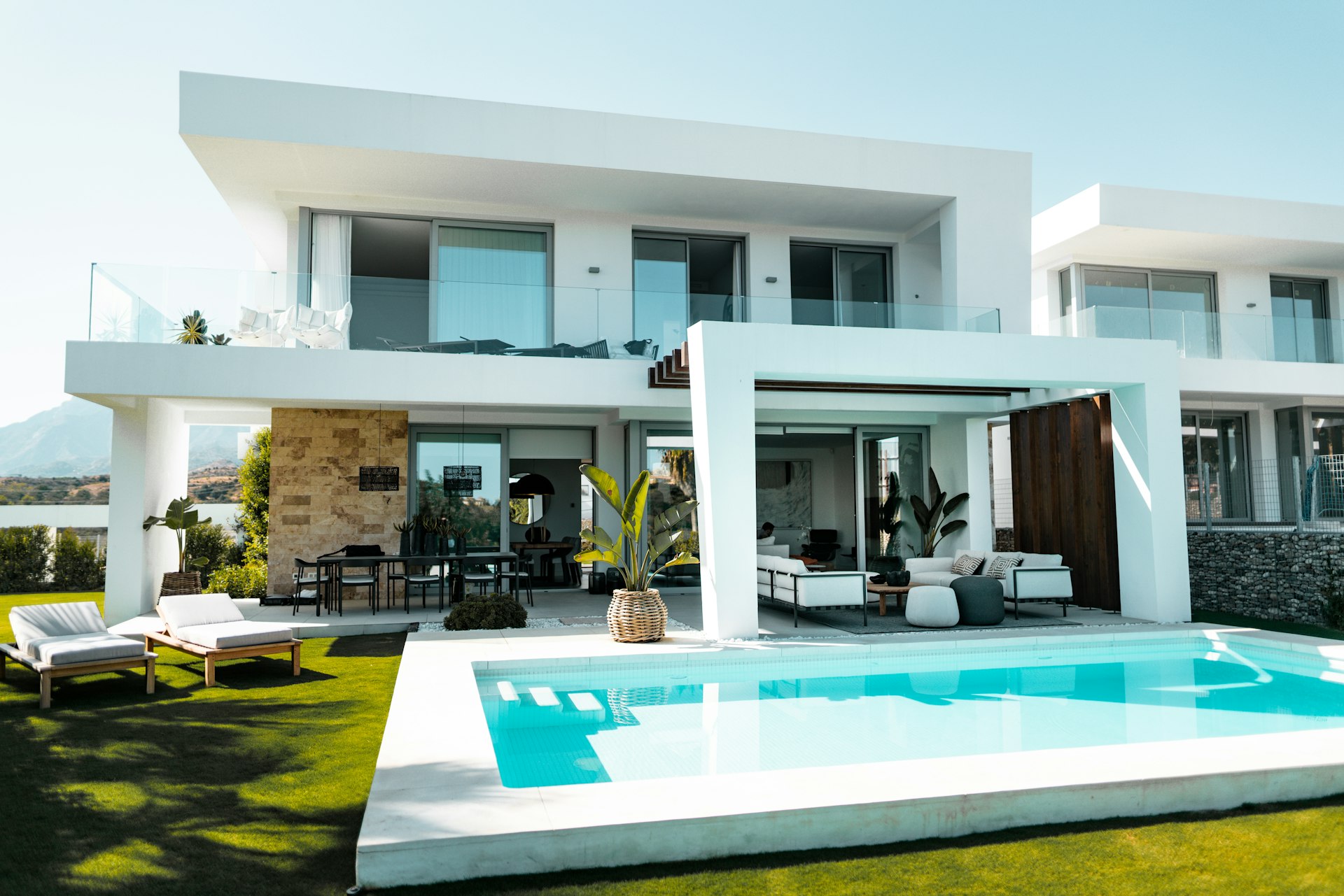 Modern stone-clad villa facade with wood accents
